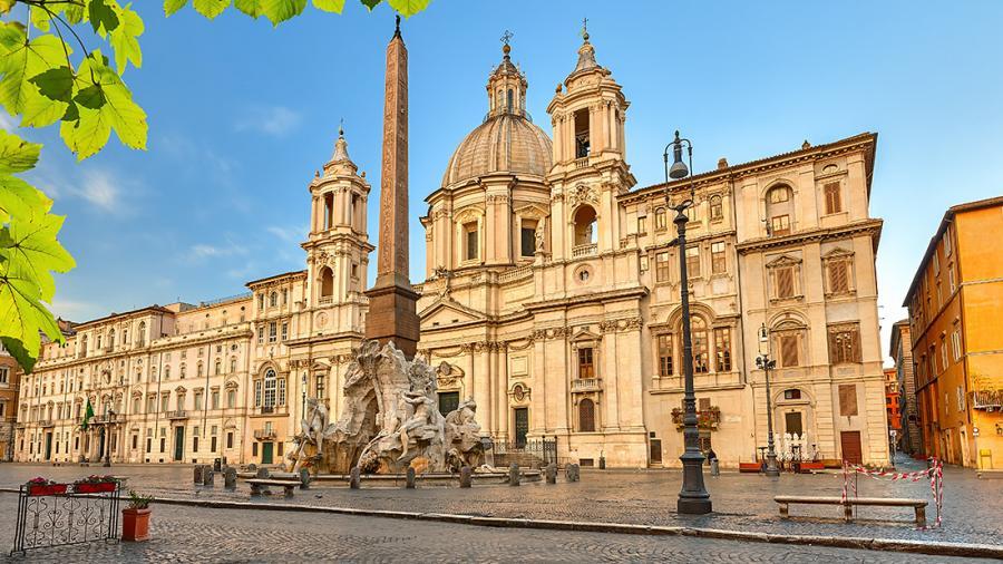 Baroque architecture and a sculpted fountain at Piazza Navona in Rome, Italy.